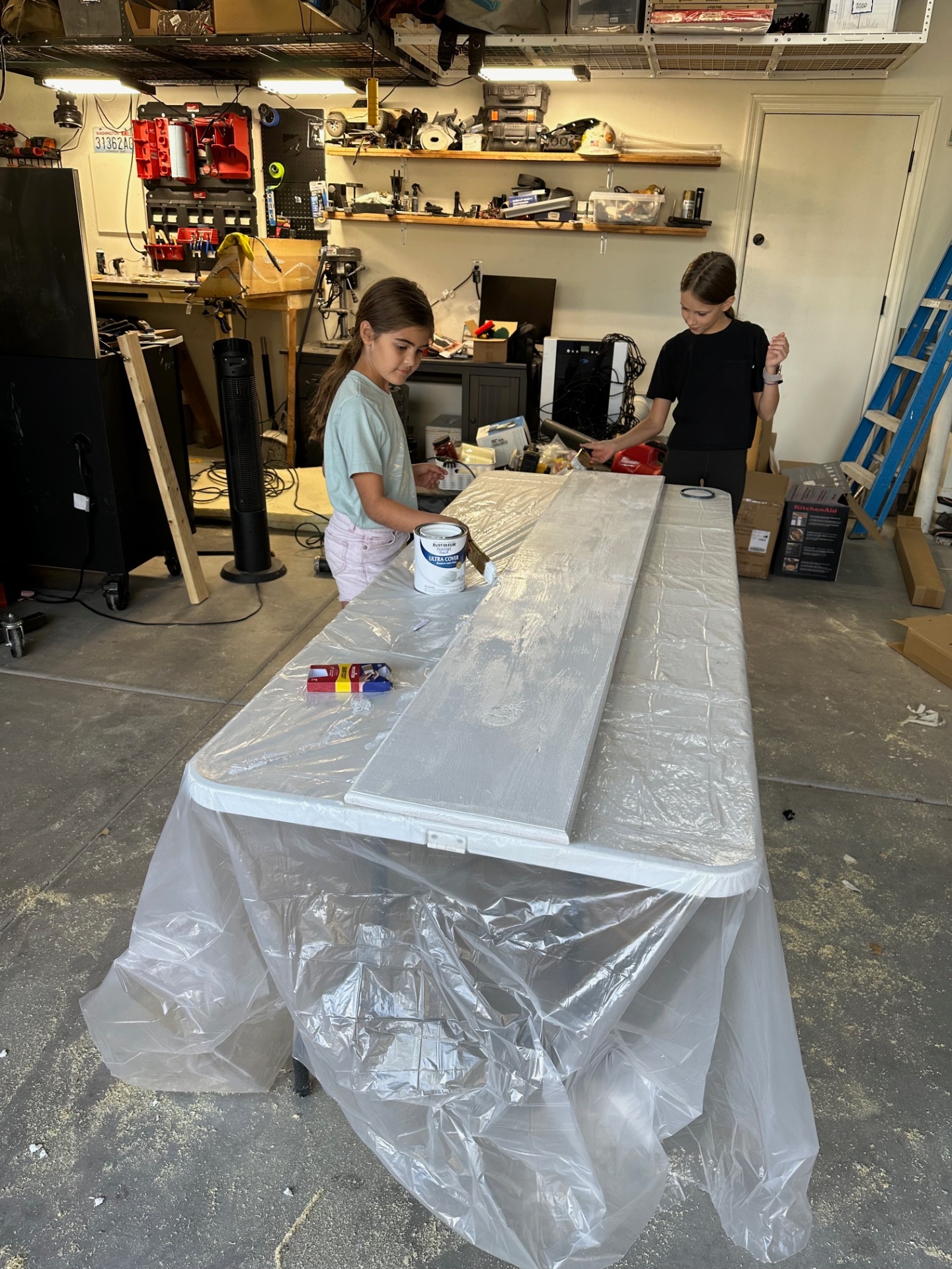 Dylan painting in the garage, real work, real skills